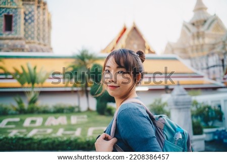Tourist asian backpack woman tracel in buddhist temple sightseeing in Bangkok Thailand Royalty-Free Stock Photo #2208386457