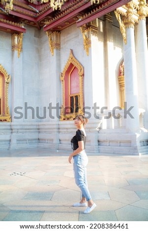 Tourist asian backpack woman tracel in buddhist temple sightseeing in Bangkok Thailand Royalty-Free Stock Photo #2208386461