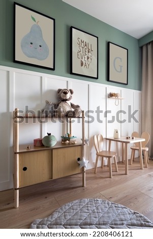 Design scandinavian kid room interior with toys, teddy bear, plush animal toys, furniture, decoration and child accessories. Mock up poster frames on the wall. Template. Stylish home decor.