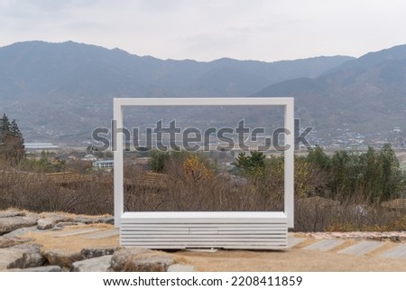 Korean mountain landscape seen through a white picture frame