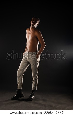 African black male is having a great model posture while being topless
