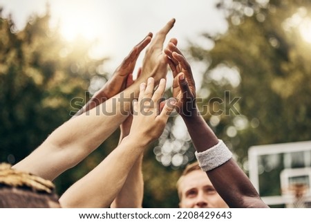 Basketball, winner and hands, team high five for outdoor game. Success, diversity and victory goal for sports for men. Teamwork, diversity and support, friends on basketball court together with coach Royalty-Free Stock Photo #2208429643