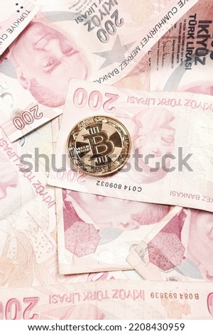 Turkish lira banknotes and bitcoin coin