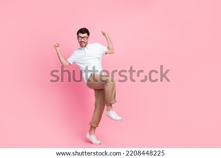 Full length photo of overjoyed man rejoice team colleagues win competition enjoy good mood empty space isolated on pink color background Royalty-Free Stock Photo #2208448225