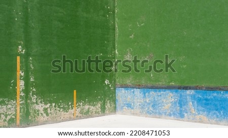 Green and blue chipping paint wall fronton background