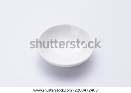 The empty small circle bowl isolated on white background - Top view Royalty-Free Stock Photo #2208472403