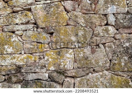 detail of a granite stone wall of an old house