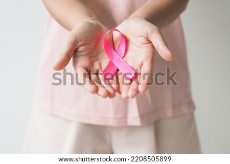 Pink breast cancer awareness ribbon. October Breast cancer awareness month. Healthcare and medicine concept.  Royalty-Free Stock Photo #2208505899