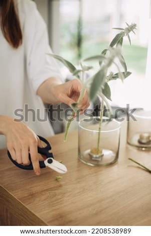 Florist making a bouquet of flowers - stock photo