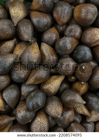 A lot of salak fruit. Salak is dark brown