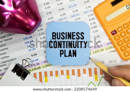 black pancel write a text BUSINESS CONTINUITY PLAN on the yellow BACKGROUND.