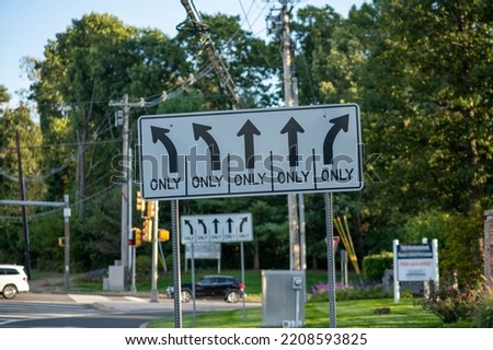 Five directional arrow one way only signs