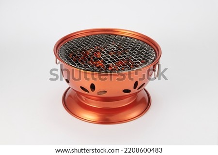 Barbecue charcoal grill stove or charcoal stove in Korean style restaurant isolated on white background.