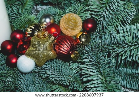 Artificial fir tree branches with Christmas tree toys