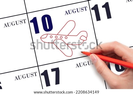 10th day of August. A hand drawing outline of airplane on calendar date 10 August. The date of flight on plane. Travel, business trips. Summer month. Day of the year