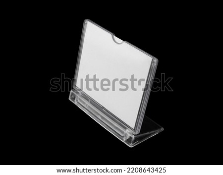 Advertising stand with white copy space isolated on black background.