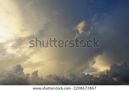Dramatic clouds in the evening sky. Evening sunset. Beautiful cloudy sky.