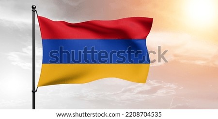 Armenia national flag cloth fabric waving on beautiful grey sky.
