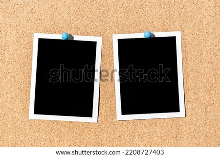 Two Blank Vintage instant photo frame pinned on corkboard. Template