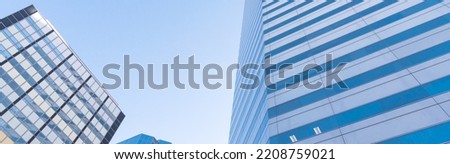 Panorama view lookup of skyscraper and cooperate office buildings in downtown Oklahoma City, USA under clear blue sky. Low angle view façade exterior of modern high rise towers