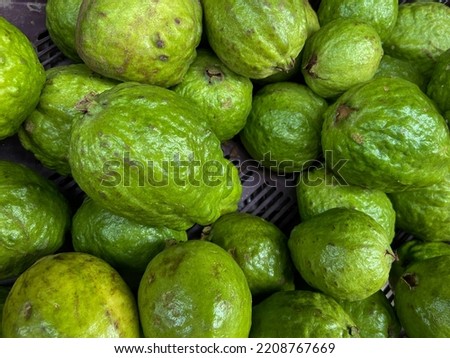 close up photo of guavas in market 
