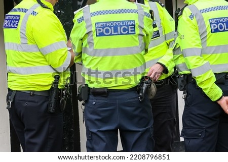 Metropolitan fully equipped Police officer back of the vest in London, UK Royalty-Free Stock Photo #2208796851
