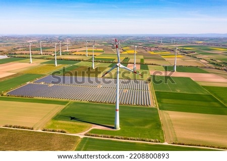 Renewable energies produced by wind turbines and solar parks on the fields in Rhineland-Palatinate Royalty-Free Stock Photo #2208800893