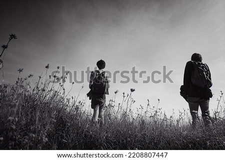stock image two people standing in a field