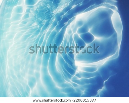Abstract​ of​ surface​ blue​ water​ in​ the​ deep​ sea​ for​ background. The​ pattern​ of​ blue​ water​ for​ background. Abstract​ of​ surface​ blue​ water. Water​ splash​ed​ for​ background.​