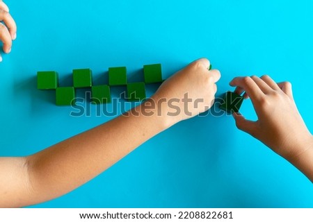 colorful stack of wood cube building blocks on white background