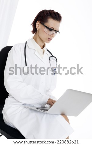 medical doctor woman with stethoscope and laptop. Isolated over white background