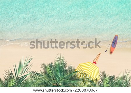 Top view of woman in bikini under umbrella lying and sunbathes on tropical Seychelles sea sand beach with palm tree grove and SUP board for surfing. Aerial, drone view