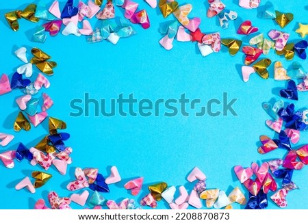 heart made of colorful paper on blue background, valentine day
