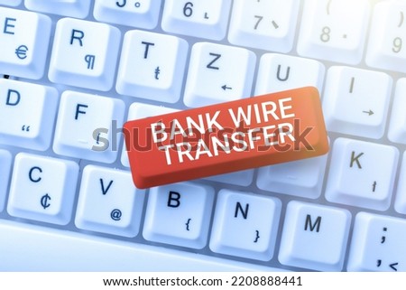 Hand writing sign Bank Wire TransferElectronic transfer of money through banks. Business concept Electronic transfer of money through financial instances