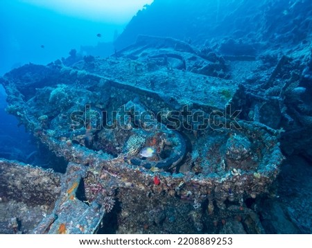 Submerged military tracked vehicles and support vehicles  at Ras Peter or Tank Reef  dive site in the Red Sea, Egypt.  Underwater photography and travel.