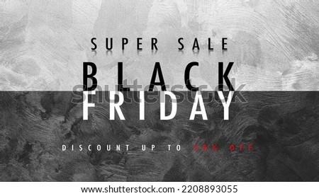Black Friday Super Sale concept, text on background of textured monochrome wall. Close-up view.