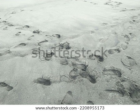 not focused abstract background footprints on the beach sand