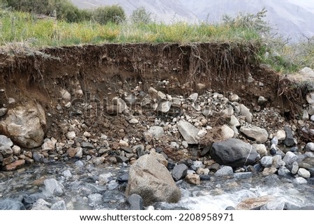 Mountain streams in Gilgit-Baltistan cause soil erosion. Royalty-Free Stock Photo #2208958971