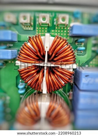 Toroidal Core Inductor mounted on the motherboard. Royalty-Free Stock Photo #2208960213