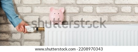 Heating Energy Bill And Saving Money. Adjusting Thermostat