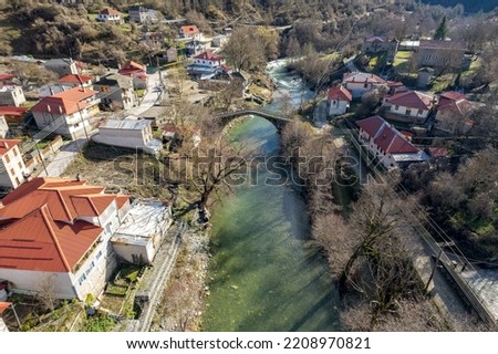 Aerial view of  Vovousa village and aoos river  located next to Valia Calda pindus national Park on east Zagori, Epirus, Greece. Royalty-Free Stock Photo #2208970821