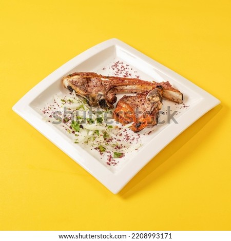 grilled chicken with vegetables yellow background 