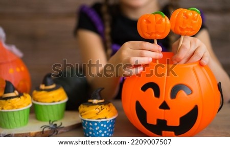 Little girl and halloween treats