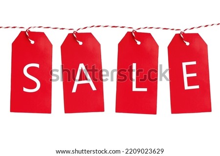 Isolated red hanging sales tags on whie background.