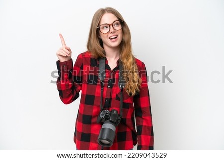Young photographer pretty woman isolated on white background intending to realizes the solution while lifting a finger up