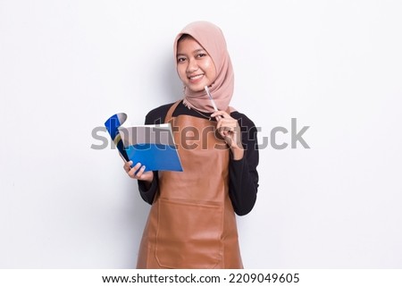 asian muslim woman barista waitress note book and thinking idea isolated on white background