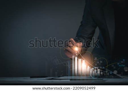 Business success concept. Businessman analyze stock market, study future marketing strategies, set goals for success, business planning, long-term investment planning, online stock trading. Royalty-Free Stock Photo #2209052499