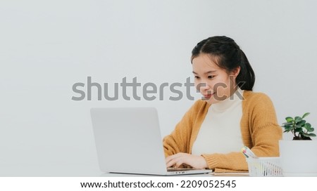 Asian woman use computer for work in office, Business woman 