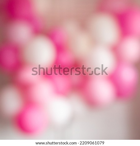 Blurred square background of festive decoration of balloons on a white background