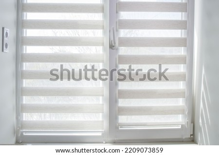 Window roller duo system day and night. Close up on roll curtains indoor Royalty-Free Stock Photo #2209073859